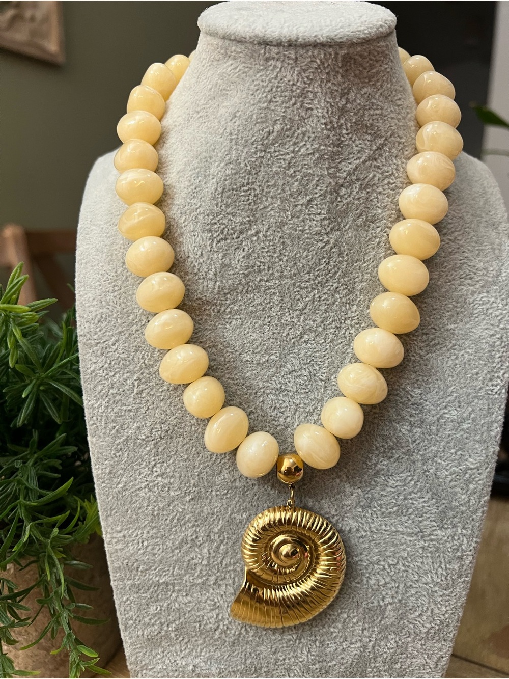Cream Beaded Necklace with Gold Nautilus Shell Pendant